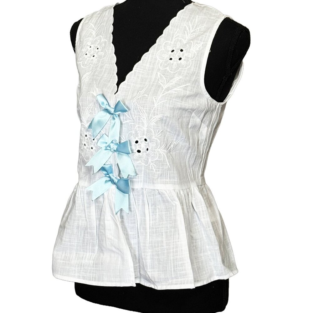 Bow Tie Front Sleeveless Peplum Blouse